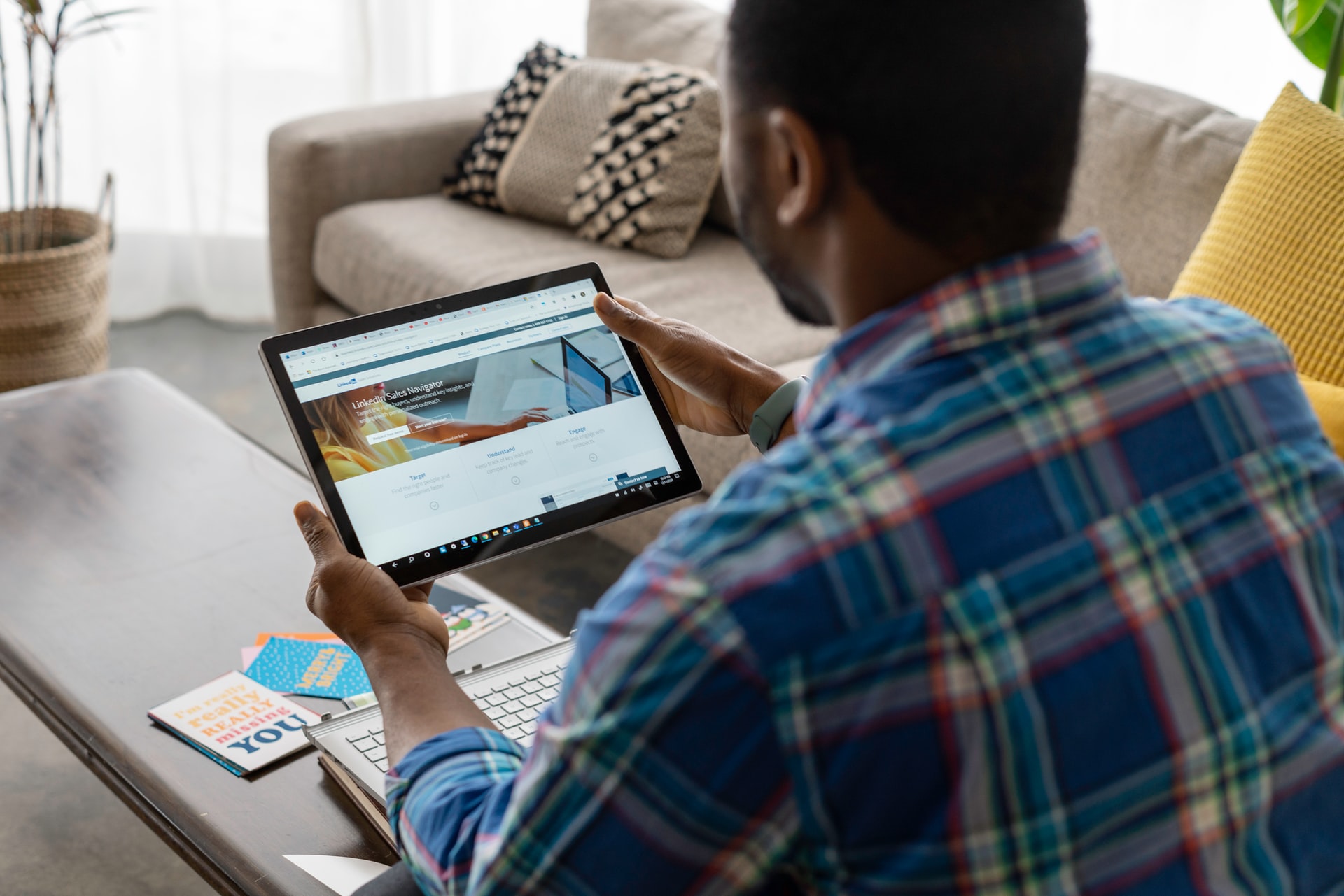 Professional Looking at a Laptop with LinkedIn Open