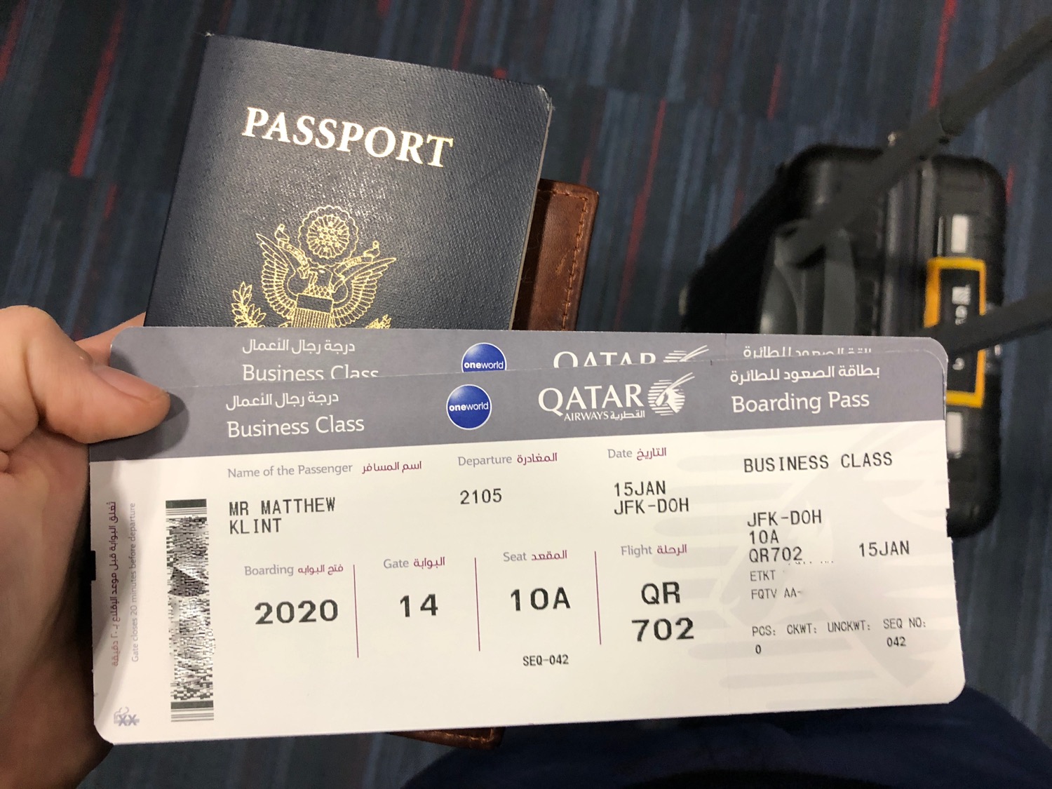 A boarding pass peeking out of a passport